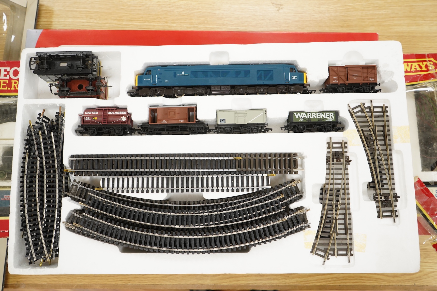 A collection of 00 gauge model railway, including three box train sets by Jouef, Mainline and Hornby, together with a large selection of unconstructed railway related plastic and metal kits and accessories, manufacturers